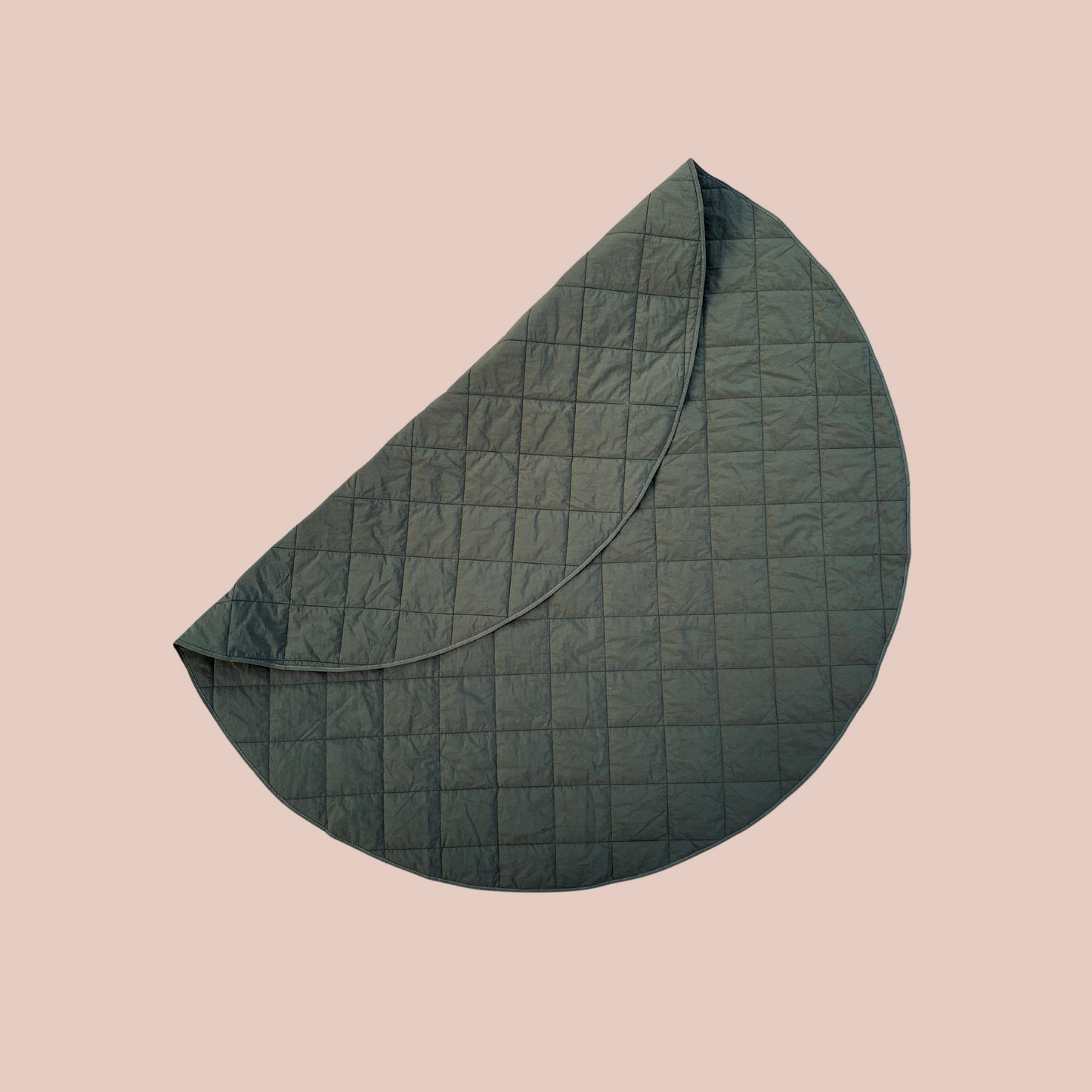 sustainable waterproof anytime rug. the perfect play mat or picnic rug in leaf colour. round 1.3m diameter. folds up into its own inbuilt pocket.