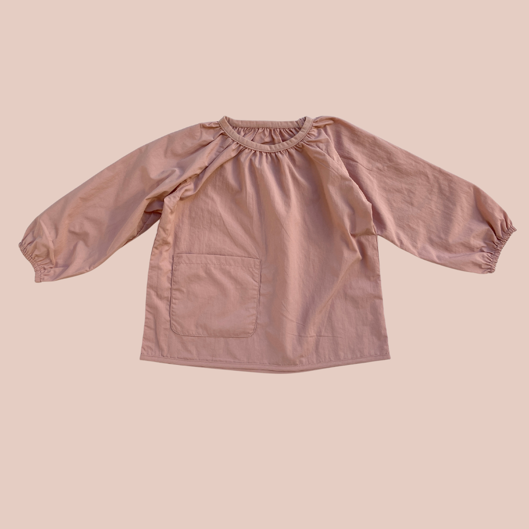 100% recycled nylon water resistant lightweight & quick drying elastic neckline and wrist signature mud pocket