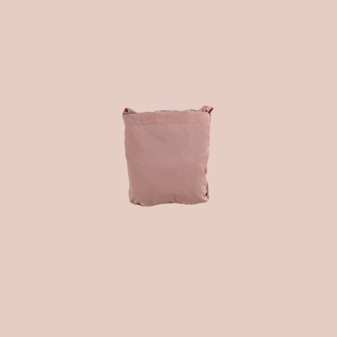 100% recycled nylon water resistant lightweight & quick drying elastic neckline and wrist signature mud pocket. pink folds up