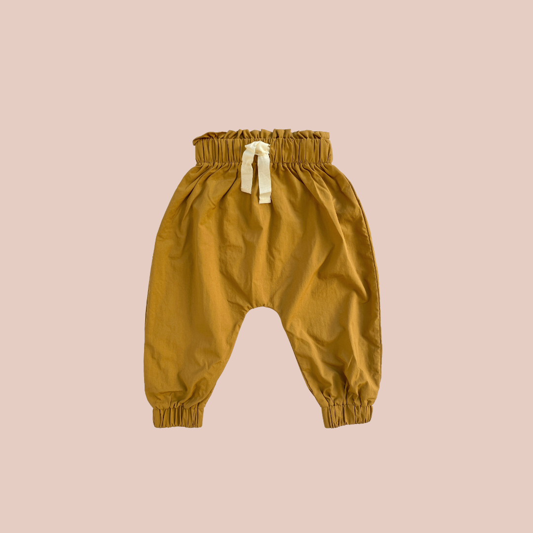 water resistant rain pants for babies and kids. designed for crawling, bush kinder and messy moments. sustainable, water play, rainwear