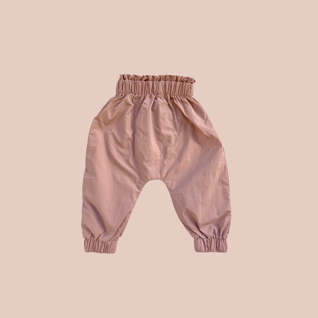 100% recycled nylon water resistant harem style leg elastic waist and ankle signature built in mud pocket